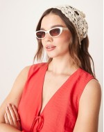 narrow cat eye sunglasses in shiny white